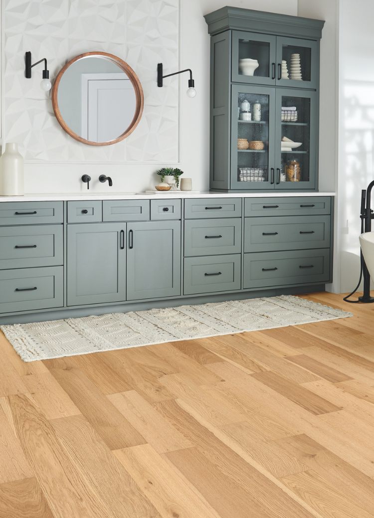 bathroom remodel with Floortech Interiors local experts with blue vanity, wood floors