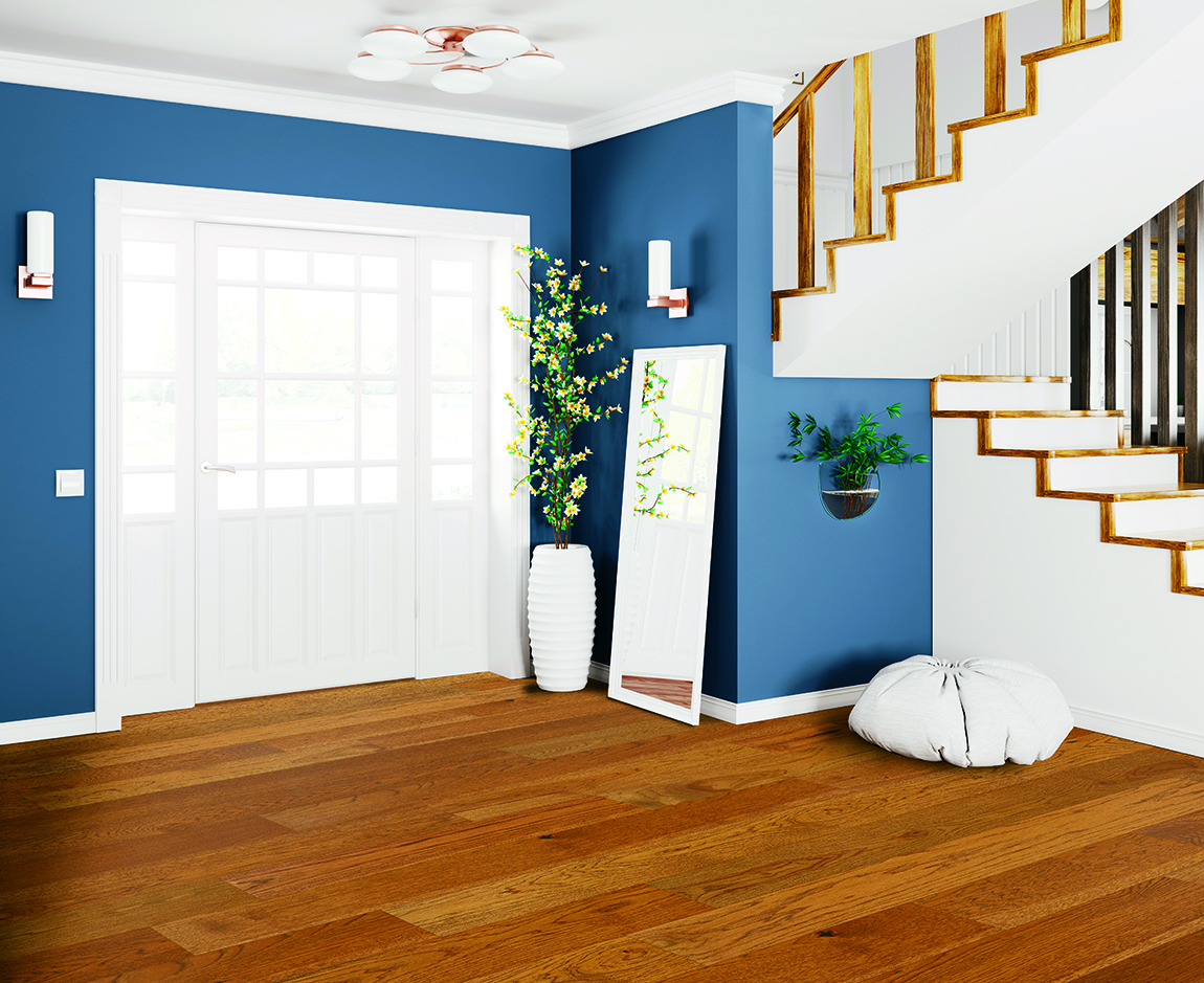 Hardwood floors in home entry way featuring stair set