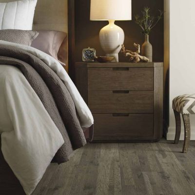 wood look laminate floors in a cozy Sturtevant bedroom